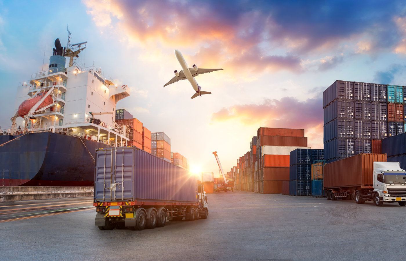 Cargo containers and trucks at a busy logistics yard